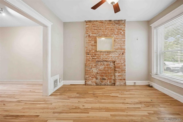 709 27th St, Denver, CO 80205 - unfurnished living room with a ceiling fan, wood finished floors, and baseboards