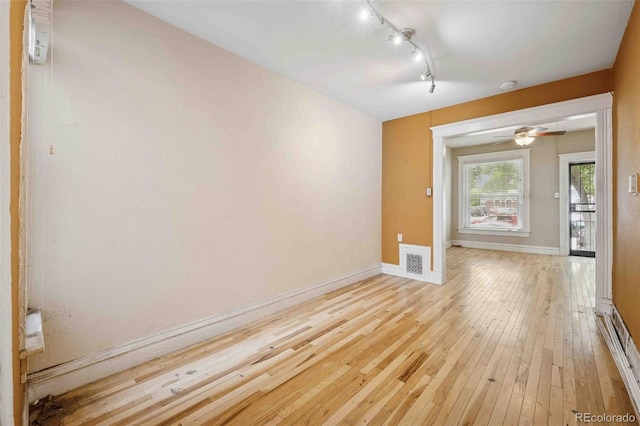 709 27th St, Denver, CO 80205 - empty room with track lighting, baseboards, light wood-style flooring, a ceiling fan, and a smoke detector