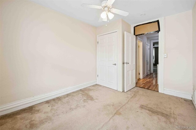 709 27th St, Denver, CO 80205 - unfurnished bedroom featuring carpet floors, baseboards, and ceiling fan