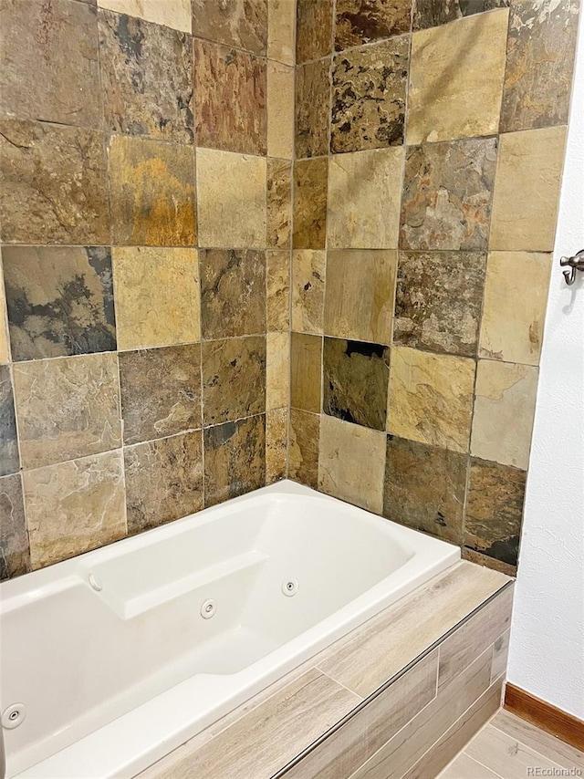 611 E 7th Ave, Denver, CO 80203 - full bath featuring baseboards and a tub with jets