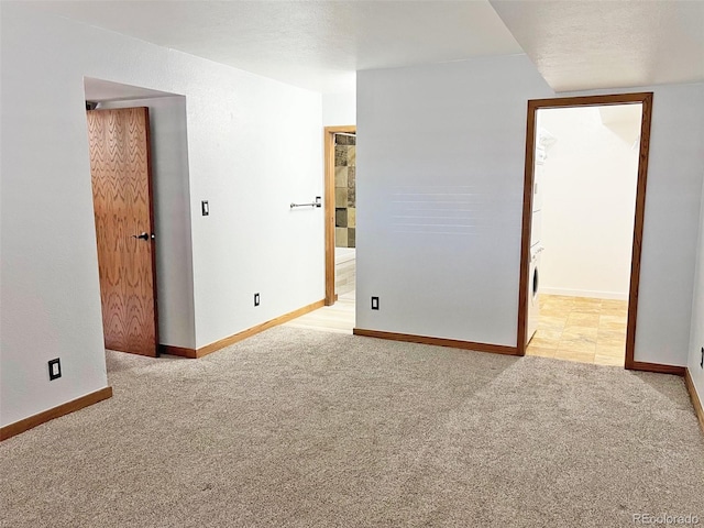 611 E 7th Ave, Denver, CO 80203 - empty room with baseboards and light carpet