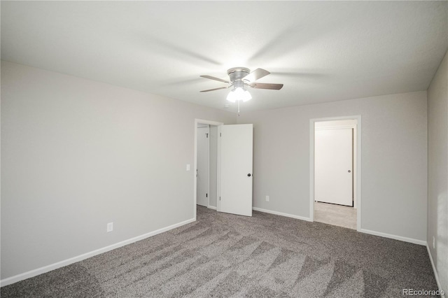 unfurnished room featuring baseboards, carpet floors, and a ceiling fan