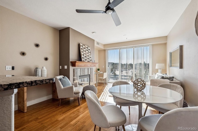 dining area featuring light hardwood / wood-style flooring and ceiling fan