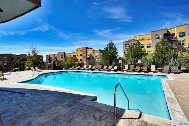 view of swimming pool featuring a patio area