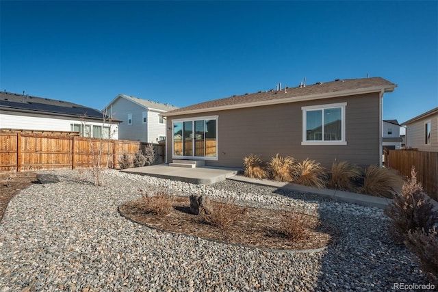 back of house featuring a patio area and fence