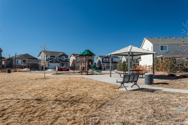 community jungle gym featuring a yard, a residential view, and a gazebo