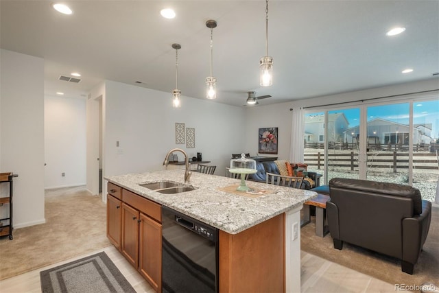 kitchen with black dishwasher, brown cabinets, open floor plan, a kitchen island with sink, and a sink