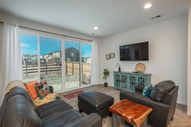 living room with recessed lighting, carpet flooring, and baseboards