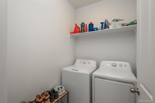 washroom featuring laundry area and washer and clothes dryer