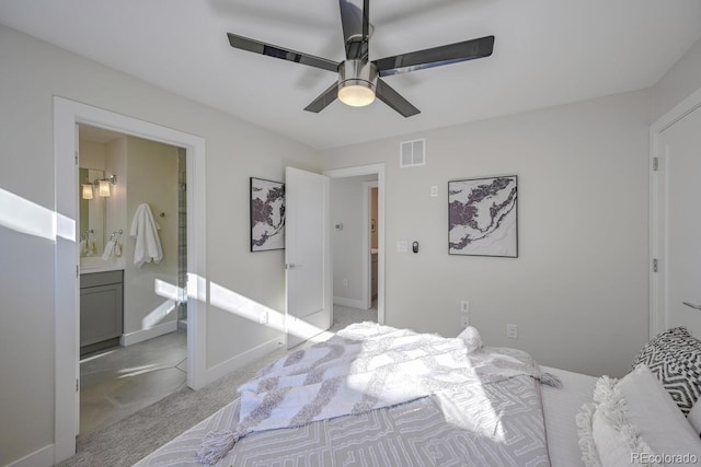 carpeted bedroom featuring ceiling fan and connected bathroom