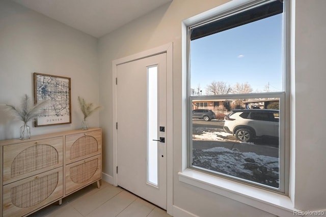 foyer featuring light tile patterned floors