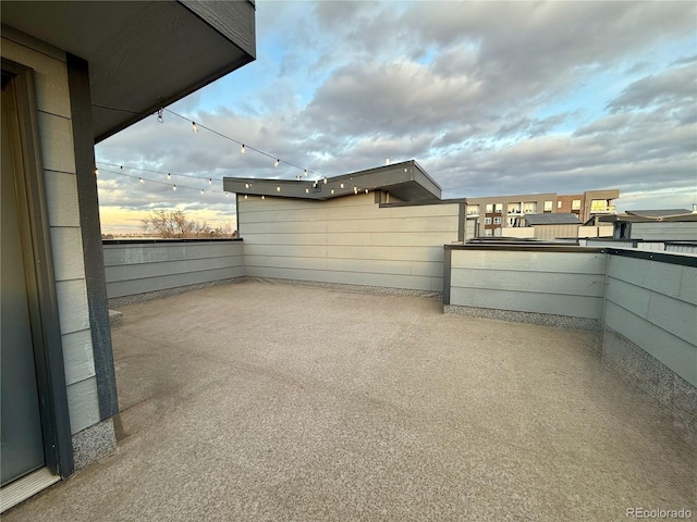 patio terrace at dusk with a balcony