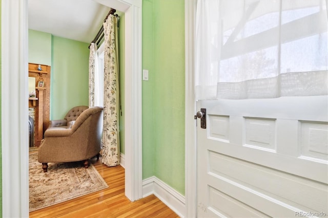 interior space with baseboards and light wood-style floors