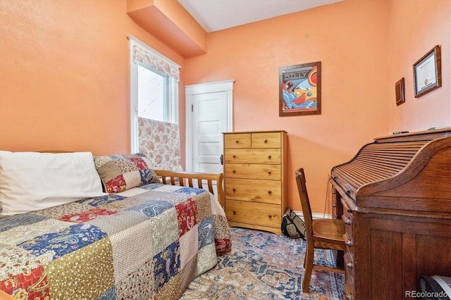 bedroom featuring baseboards