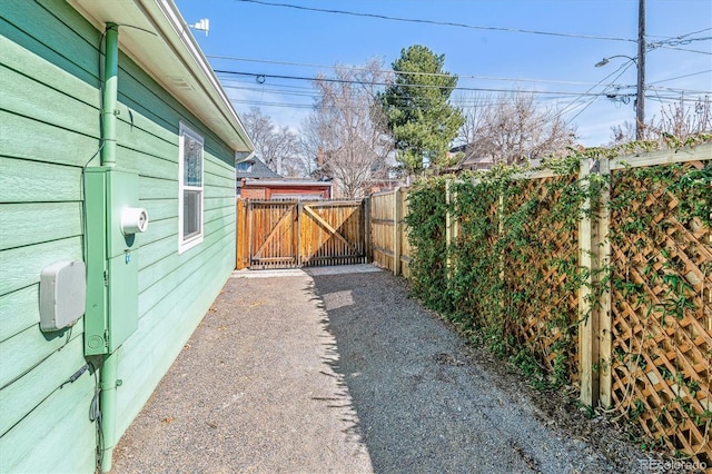 view of yard with a gate and fence