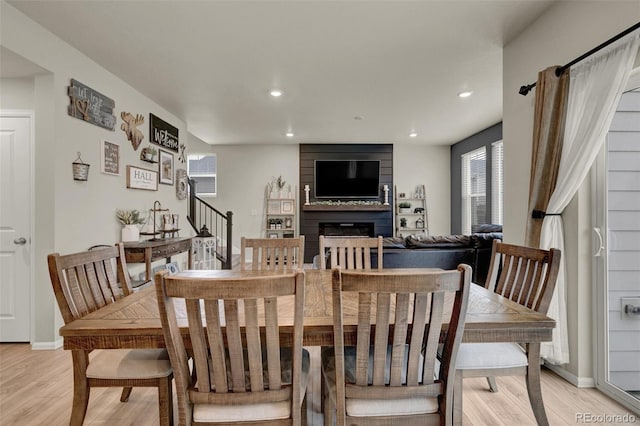 dining area with light hardwood / wood-style floors