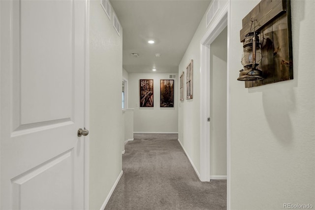 corridor with light colored carpet