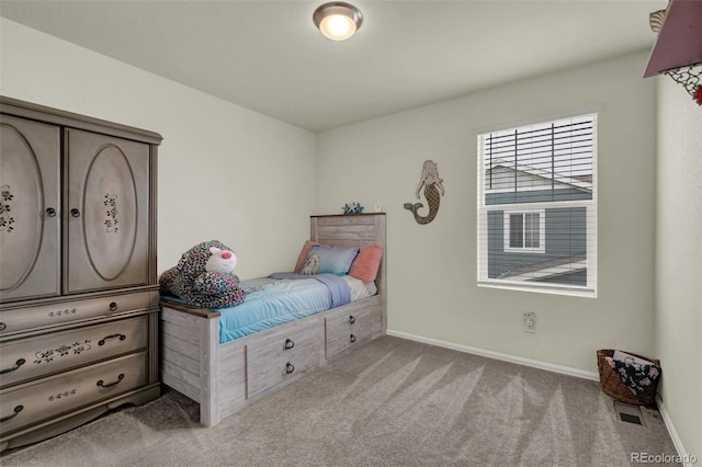 bedroom with light carpet