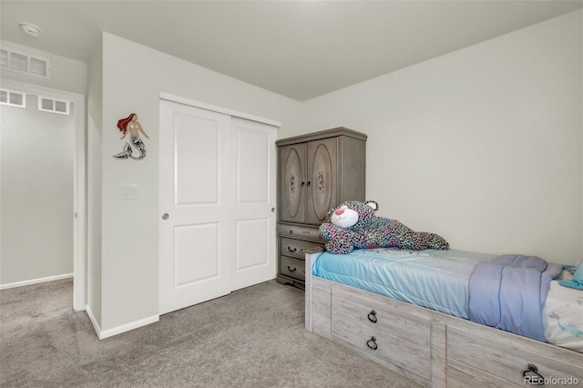 carpeted bedroom featuring a closet