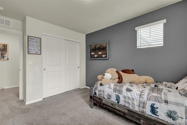 bedroom with a closet and carpet