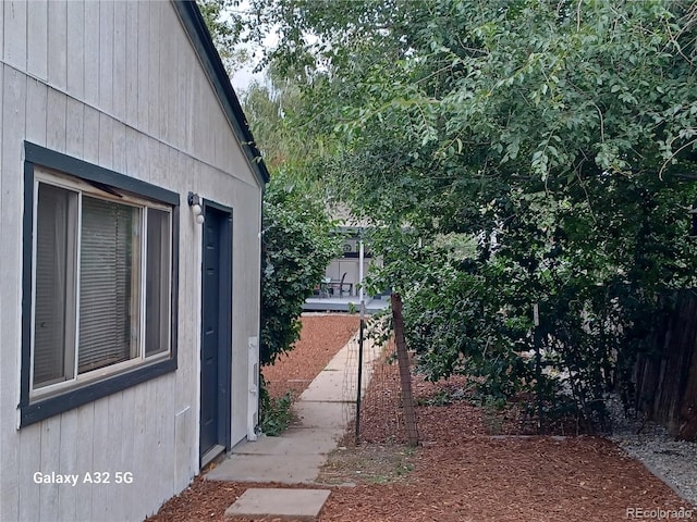 view of home's exterior with fence