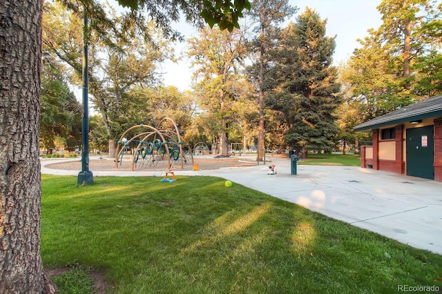 surrounding community with playground community and a lawn