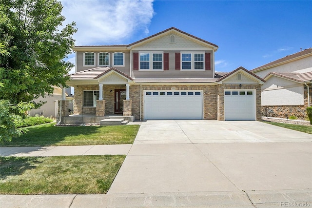 5131 Netherland St, Denver, CO 80249 - view of front facade with driveway, a front yard, covered porch, and an attached garage