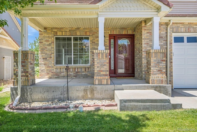 5131 Netherland St, Denver, CO 80249 - doorway to property featuring covered porch, a garage, and brick siding