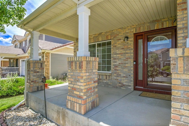 5131 Netherland St, Denver, CO 80249 - view of exterior entry with a porch and brick siding