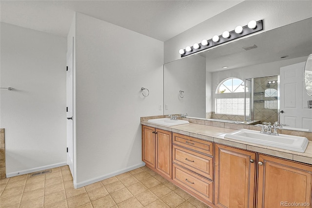 5131 Netherland St, Denver, CO 80249 - full bathroom featuring double vanity and a tile shower
