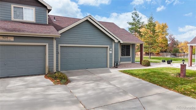 view of front facade with a front lawn and a garage