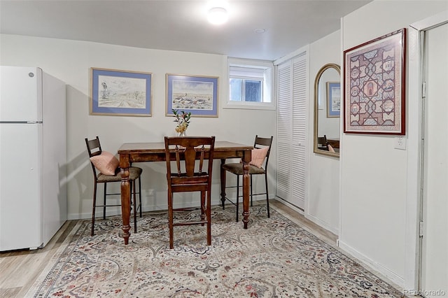 1434 Osceola St, Denver, CO 80204 - dining room featuring wood finished floors and baseboards