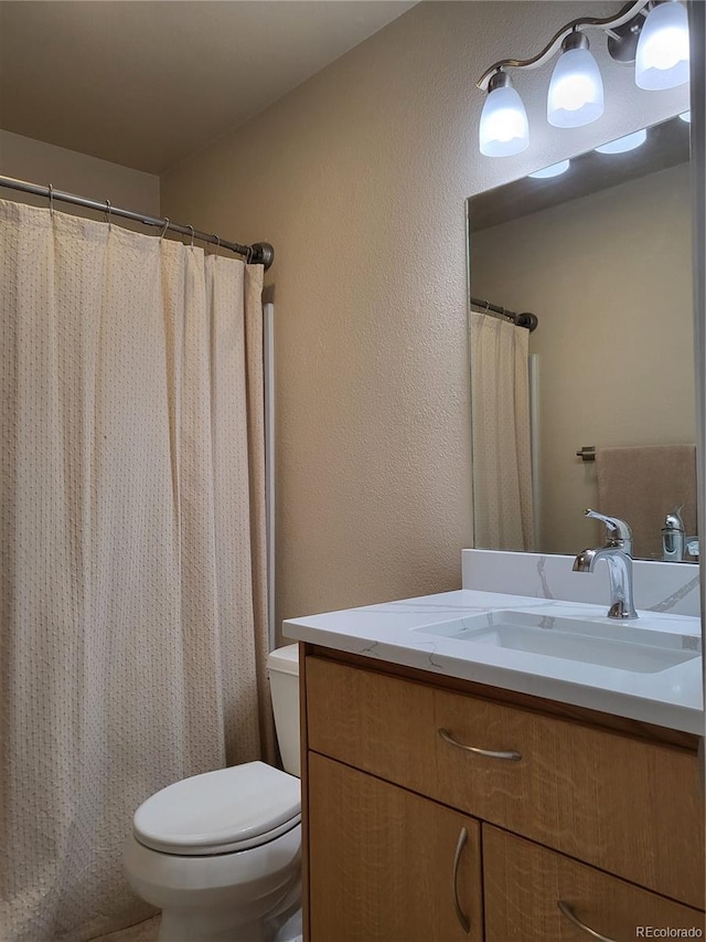 9105 E Lehigh Ave Unit 105, Denver, CO 80237 - bathroom with toilet and vanity