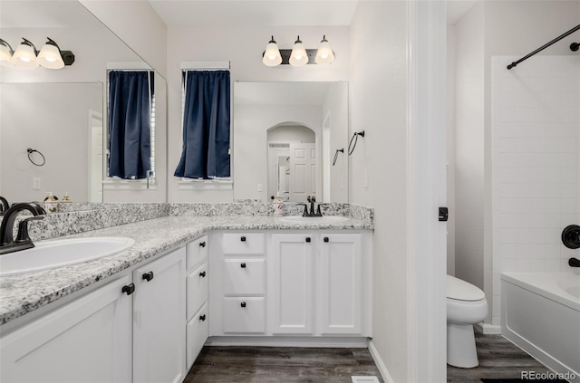 527 English Sparrow Trl, Highlands Ranch, CO 80129 - full bath with wood finished floors, double vanity, toilet, and shower / bath combination