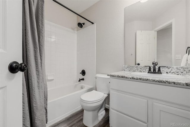 527 English Sparrow Trl, Highlands Ranch, CO 80129 - bathroom featuring wood finished floors, vanity, shower / bath combo with shower curtain, and toilet