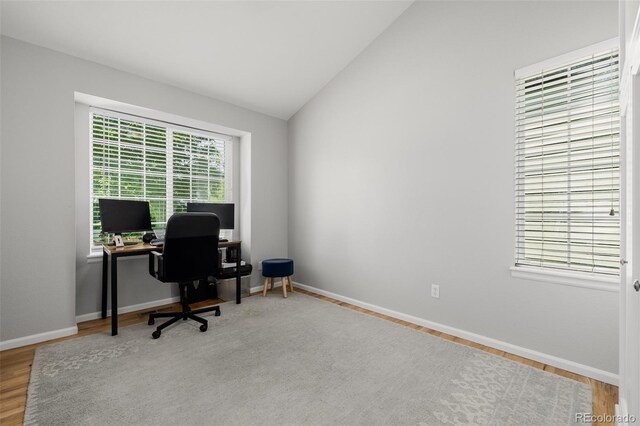 527 English Sparrow Trl, Highlands Ranch, CO 80129 - office area featuring vaulted ceiling, wood finished floors, and baseboards