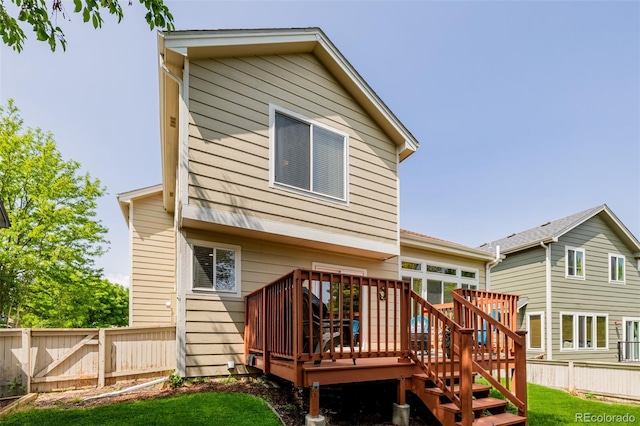 527 English Sparrow Trl, Highlands Ranch, CO 80129 - rear view of house with a wooden deck