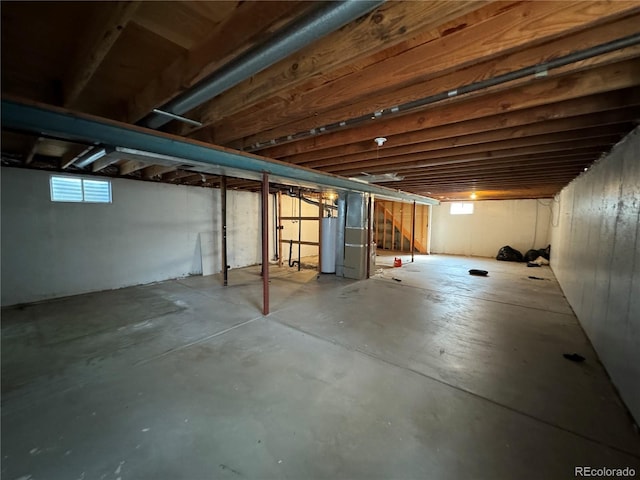 basement with gas water heater and heating unit