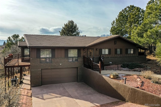 view of front of house featuring a garage and central air condition unit