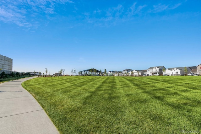 5913 Sawdust Dr, Brighton, CO 80601 - view of home's community featuring a residential view and a yard