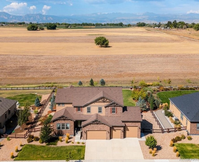 aerial view with a mountain view and a rural view