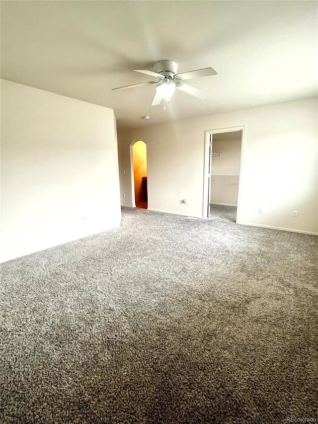 carpeted empty room with ceiling fan