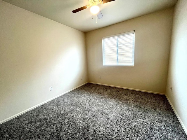 spare room featuring carpet flooring and ceiling fan