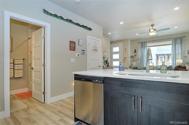 kitchen with light hardwood / wood-style flooring, stainless steel dishwasher, ceiling fan, and sink