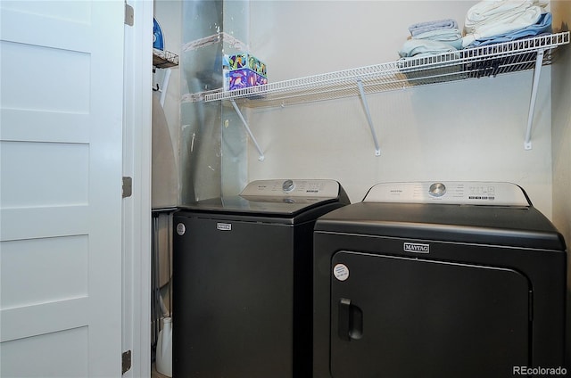 washroom with independent washer and dryer