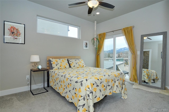 bedroom featuring carpet, a mountain view, access to outside, and ceiling fan