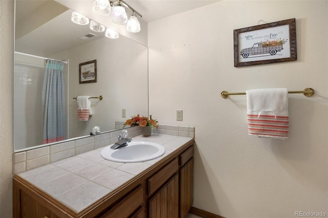 bathroom featuring vanity and a shower with curtain