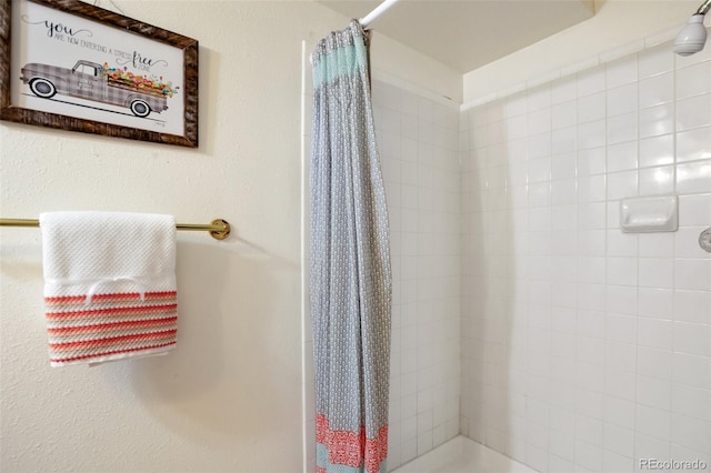 bathroom with a shower with curtain