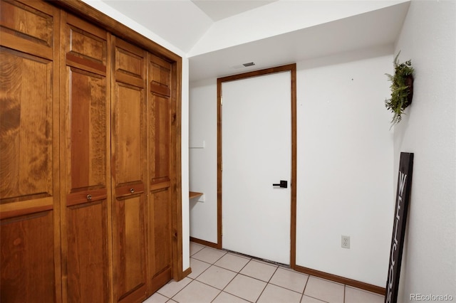 hall with light tile patterned flooring