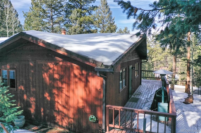 view of side of property featuring a deck